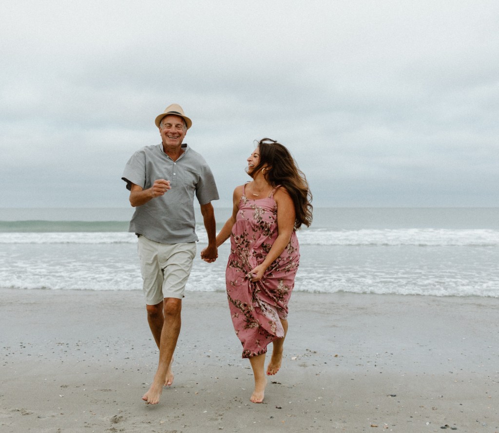 Couple running on beach