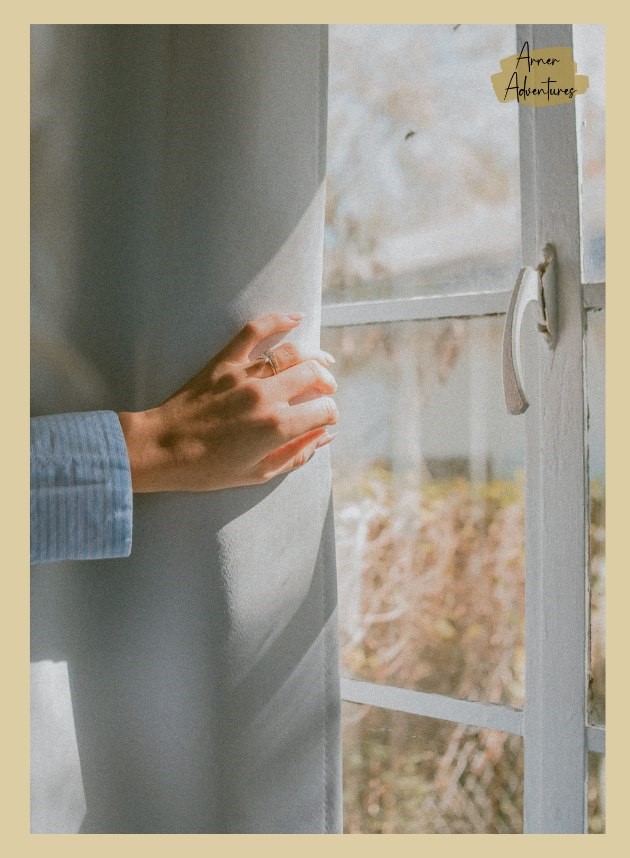 hand pulling back the curtain